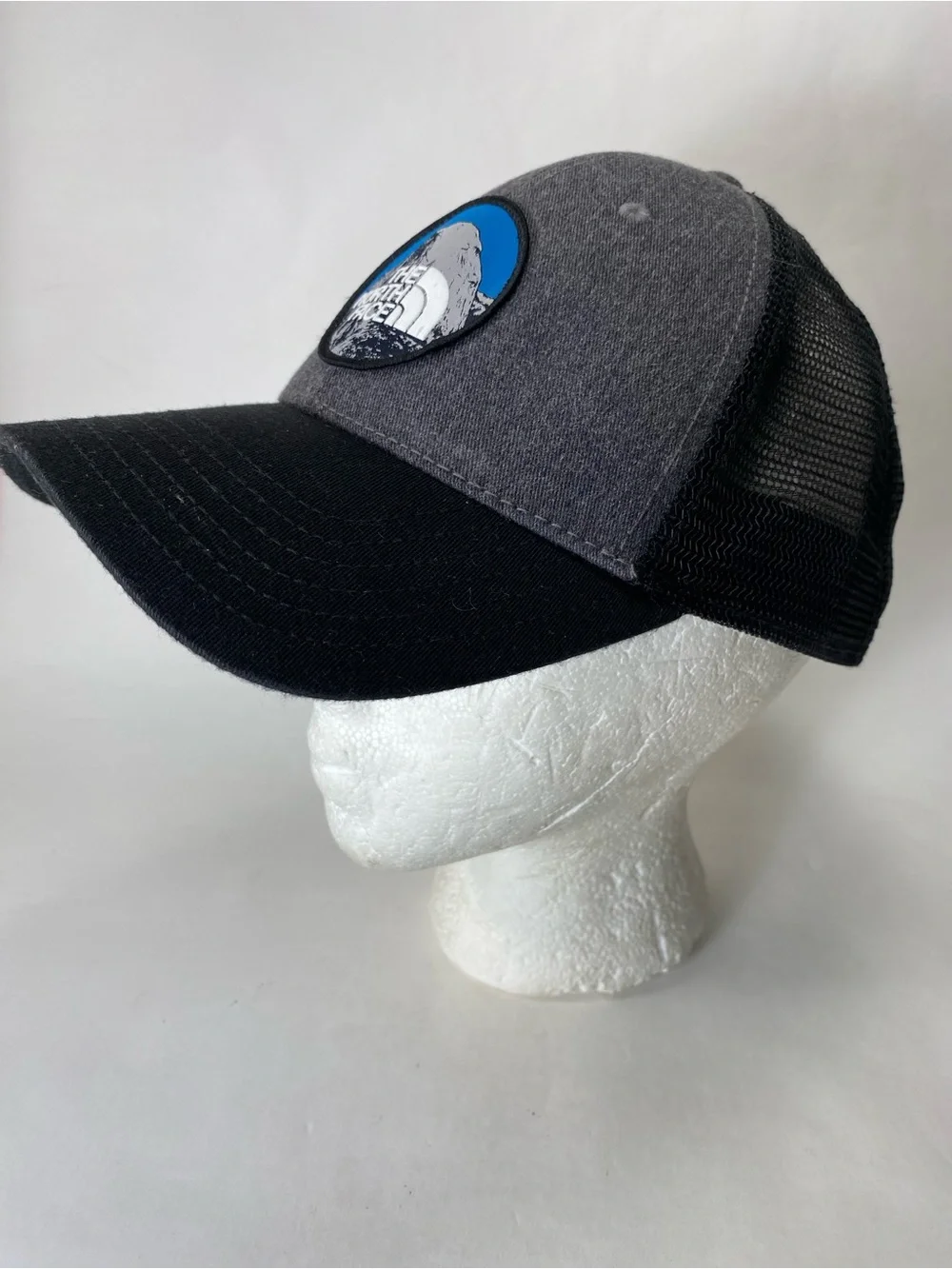 The North Face Grey & Black Patch Trucker Hat with Blue Accent Snap Back Unisex